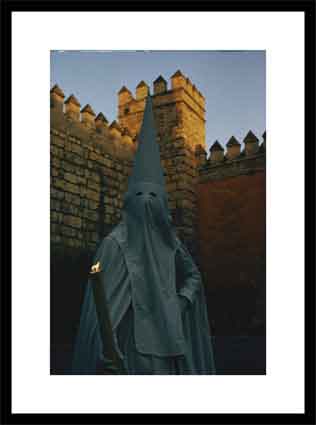Masked penitent photographed during an Easter celebration